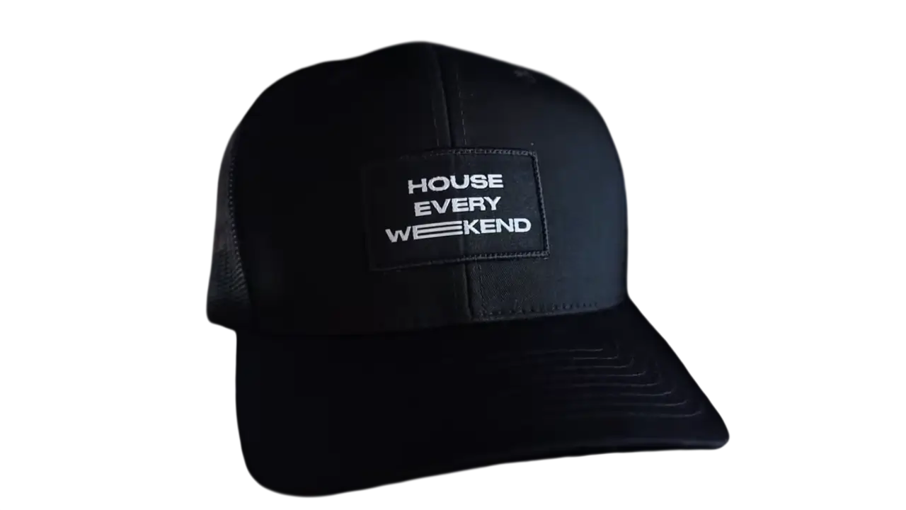 Black trucker hat with woven text patch reading House Every Weekend