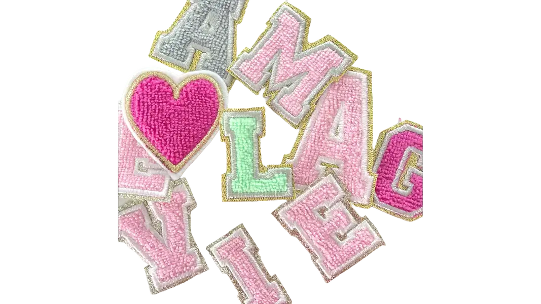chenille letter patches in pastel colors with heart design showing raised varsity texture