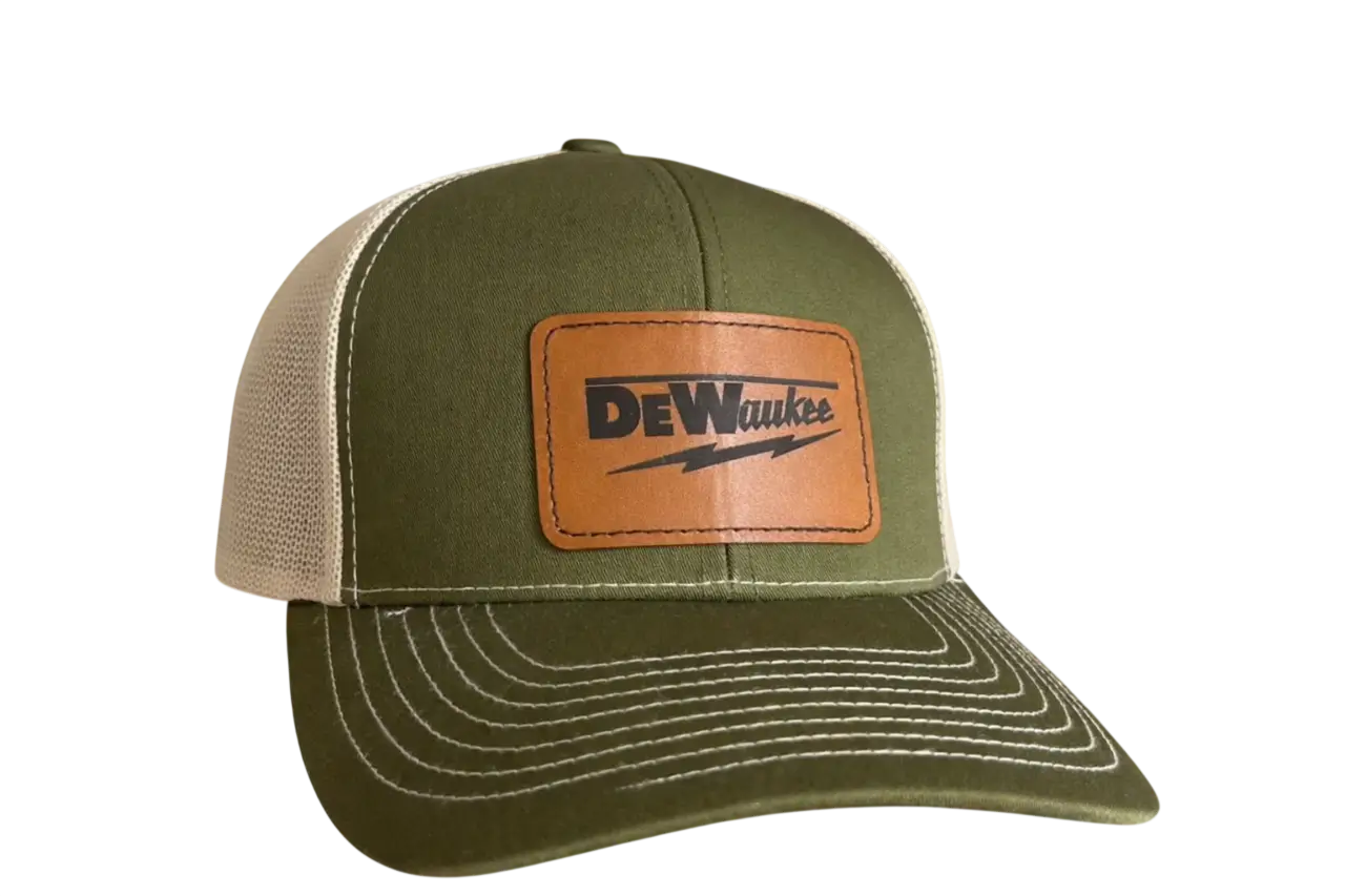 Olive green trucker hat with leather patch and stitched brim
