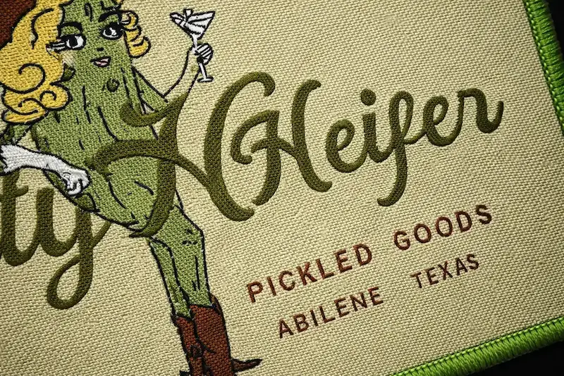 Woven patch showing fine thread texture and smooth color blending.