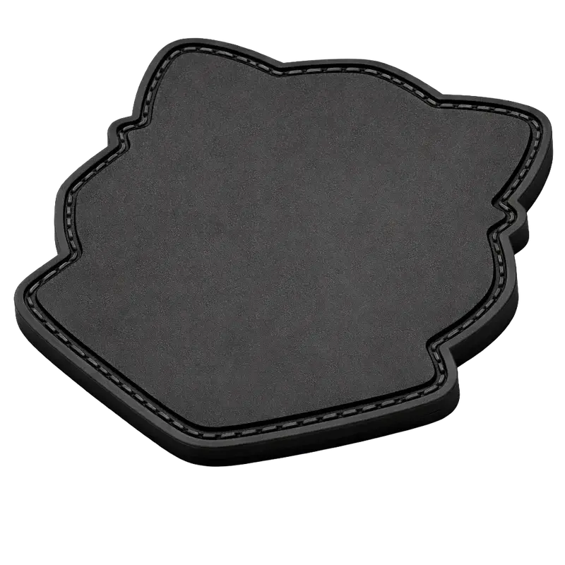 Standard plain black rubber backing on a PVC patch with a recessed sewing groove channel for permanent uniform stitching.